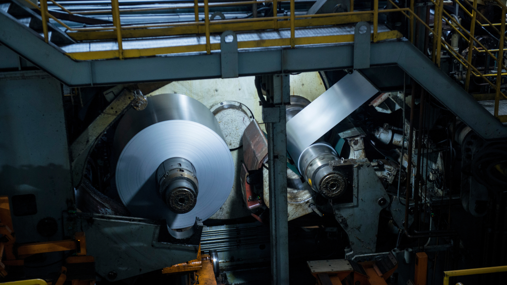 Cold rolling mill in operation, processing steel sheets to enhance quality and durability.